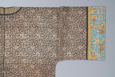 A Chinese embroidered silk woman's robe with floral scrolls, 19th C.
