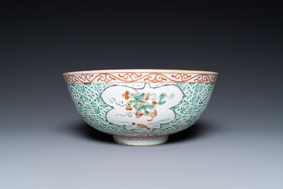 A Chinese famille verte relief-decorated bowl with squirrels and rabbits, Kangxi