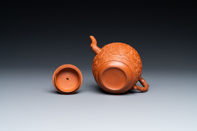 A Chinese Yixing stoneware teapot with boys among peony scrolls, Kangxi