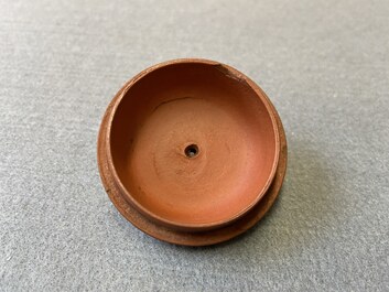 A Chinese Yixing stoneware teapot with boys among peony scrolls, Kangxi
