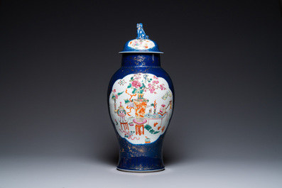 A Chinese blue-ground famille rose vase and cover, Kangxi mark, 19th C.