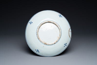 A Chinese blue, white and copper red ko-sometsuke 'fish' plate for the Japanese market, Transitional period