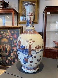 A Chinese blue, white and copper red 'antiquities' bottle vase, Qianlong