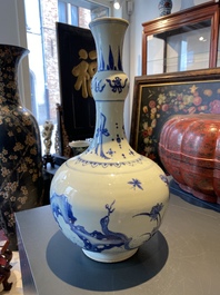 A Chinese blue and white bottle vase with a frog, a lizard and butterflies, Transitional period