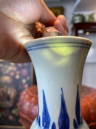 A Chinese blue and white bottle vase with a frog, a lizard and butterflies, Transitional period