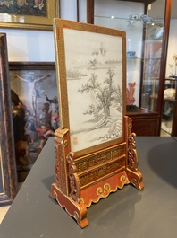 A Chinese famille rose table screen with a winter landscape and a scene with Europeans, various seals, Qianlong mark, 18/19th C.