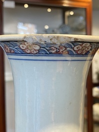 A Chinese blue, white and copper red 'antiquities' bottle vase, Qianlong