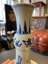 A Chinese blue and white bottle vase with a frog, a lizard and butterflies, Transitional period