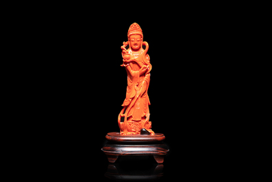 A Chinese carved red coral 'Guanyin' figure, 19/20th C.