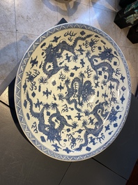 A massive Chinese blue and white 'dragon' dish, Kangxi mark, 19th C.