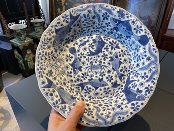 A pair of Chinese lobed blue and white 'fish' dishes, Kangxi
