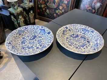A pair of Chinese lobed blue and white 'fish' dishes, Kangxi