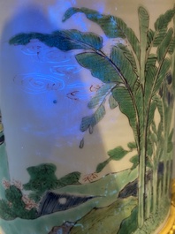 A Chinese famille verte brush pot on gilt bronze stand, Kangxi