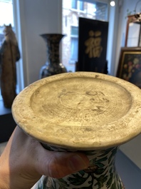 A Chinese verte biscuit 'peony scroll' vase, Ming