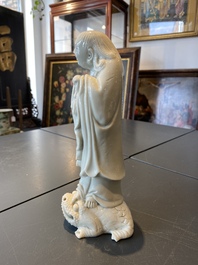 A Chinese Dehua blanc de Chine figure of Liu Hai with the toad, Kangxi