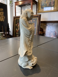 A Chinese Dehua blanc de Chine figure of Liu Hai with the toad, Kangxi