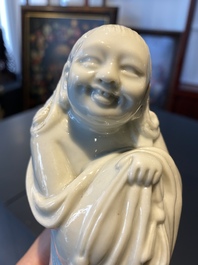 A Chinese Dehua blanc de Chine figure of Liu Hai with the toad, Kangxi