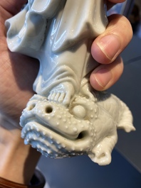 A Chinese Dehua blanc de Chine figure of Liu Hai with the toad, Kangxi