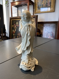 A Chinese Dehua blanc de Chine figure of Liu Hai with the toad, Kangxi
