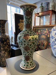 A Chinese verte biscuit 'peony scroll' vase, Ming