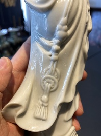 A Chinese Dehua blanc de Chine figure of Liu Hai with the toad, Kangxi