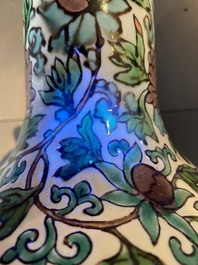 A Chinese verte biscuit 'peony scroll' vase, Ming