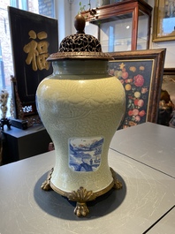 Een Chinese celadon 'lotusslingers' vaas met blauw-witte en koperrode panelen, Kangxi