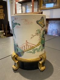 A Chinese famille verte brush pot on gilt bronze stand, Kangxi