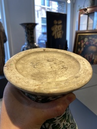 A Chinese verte biscuit 'peony scroll' vase, Ming