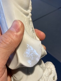 A Chinese Dehua blanc de Chine figure of Liu Hai with the toad, Kangxi