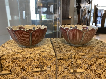 A pair of Chinese blue, white and copper-red 'lotus' bowls, Kangxi mark, 19th C.