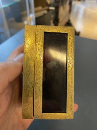 A Chinese gilt-copper box set with glass plaques, Beijing Imperial workshops, Qianlong