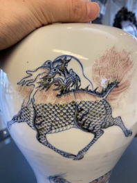 A Chinese blue, white and copper-red 'meiping' vase with mythical animals, Qianlong mark, 18/19th C.