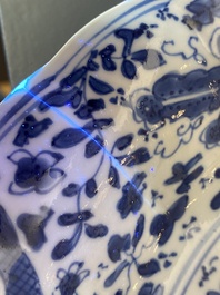 A Chinese blue and white lobed 'crab and fish' dish, Yu mark, Kangxi