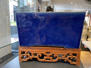 A Chinese rectangular blue-glazed jardini&egrave;re on wooden stand, 19th C.