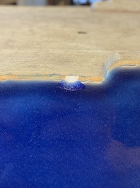 A Chinese rectangular blue-glazed jardini&egrave;re on wooden stand, 19th C.
