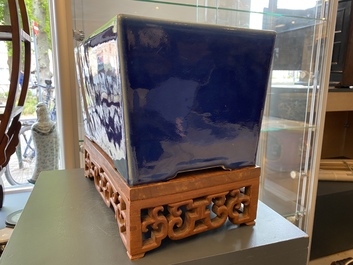 A Chinese rectangular blue-glazed jardini&egrave;re on wooden stand, 19th C.
