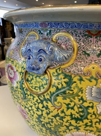 A large Chinese famille rose yellow-ground fish bowl with fine floral scrolls, 19th C.