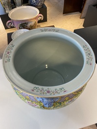 A large Chinese famille rose yellow-ground fish bowl with fine floral scrolls, 19th C.