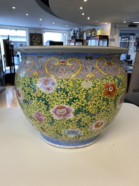 A large Chinese famille rose yellow-ground fish bowl with fine floral scrolls, 19th C.