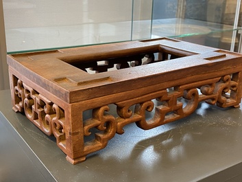 A Chinese rectangular blue-glazed jardini&egrave;re on wooden stand, 19th C.