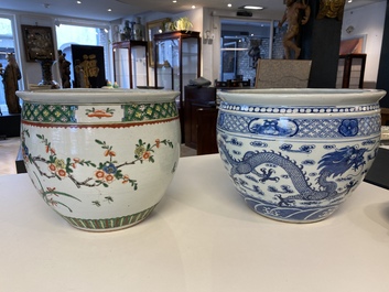 A Chinese blue and white 'dragons' fish bowl and a famille verte 'magpies' fish bowl, 19th C.