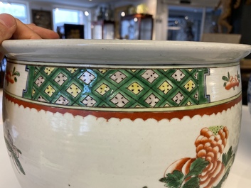 A Chinese blue and white 'dragons' fish bowl and a famille verte 'magpies' fish bowl, 19th C.