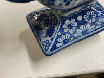 A Dutch Delft blue and white heart-shaped tulip vase with putti, 1st half 18th C.