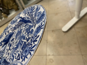 A pair of Chinese blue and white lobed 'phoenix and monkey' plates, Kangxi