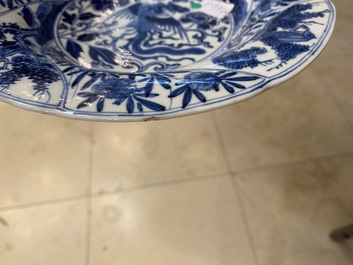 A pair of Chinese blue and white lobed 'phoenix and monkey' plates, Kangxi