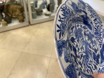 A pair of Chinese blue and white lobed 'phoenix and monkey' plates, Kangxi