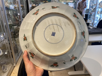A pair of Chinese famille verte 'mythical animals' dishes, seal marks, Kangxi