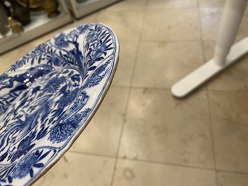 A pair of Chinese blue and white lobed 'phoenix and monkey' plates, Kangxi