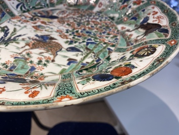 A pair of Chinese famille verte 'mythical animals' dishes, seal marks, Kangxi